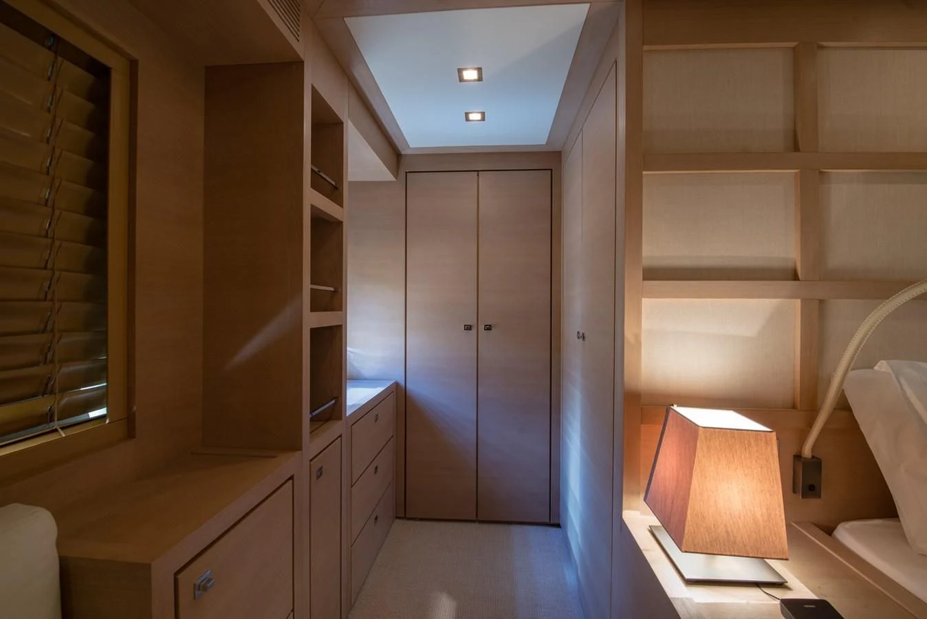 a room with a closet and a shelf with drawers aboard SUN ANEMOS Yacht for Charter
