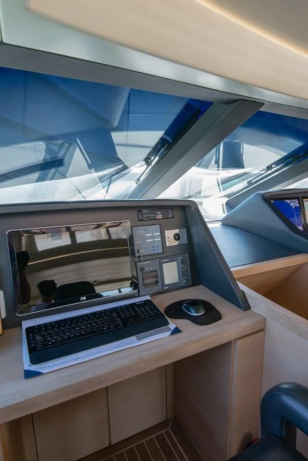 a computer on a table aboard SUN ANEMOS Yacht for Charter