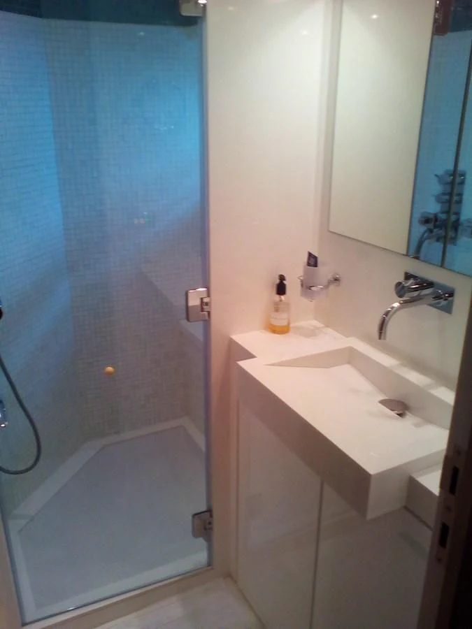 a bathroom with a sink and a mirror aboard SUN ANEMOS Yacht for Charter