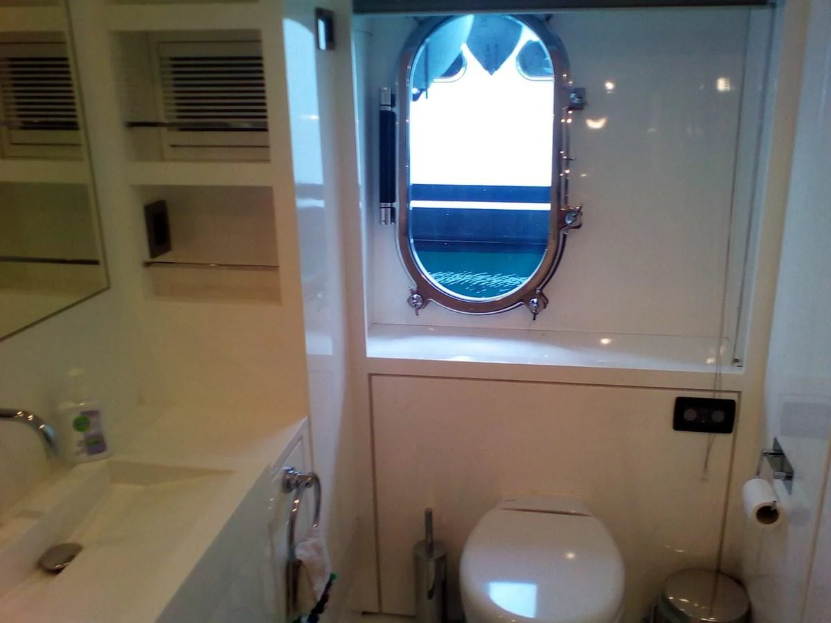 a bathroom with a toilet and a sink aboard SUN ANEMOS Yacht for Charter