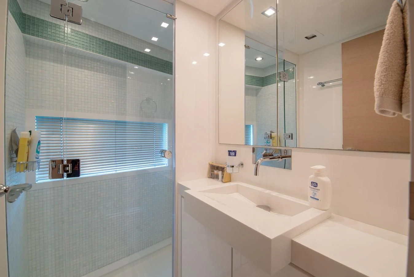 a bathroom with a sink and a shower aboard SUN ANEMOS Yacht for Charter