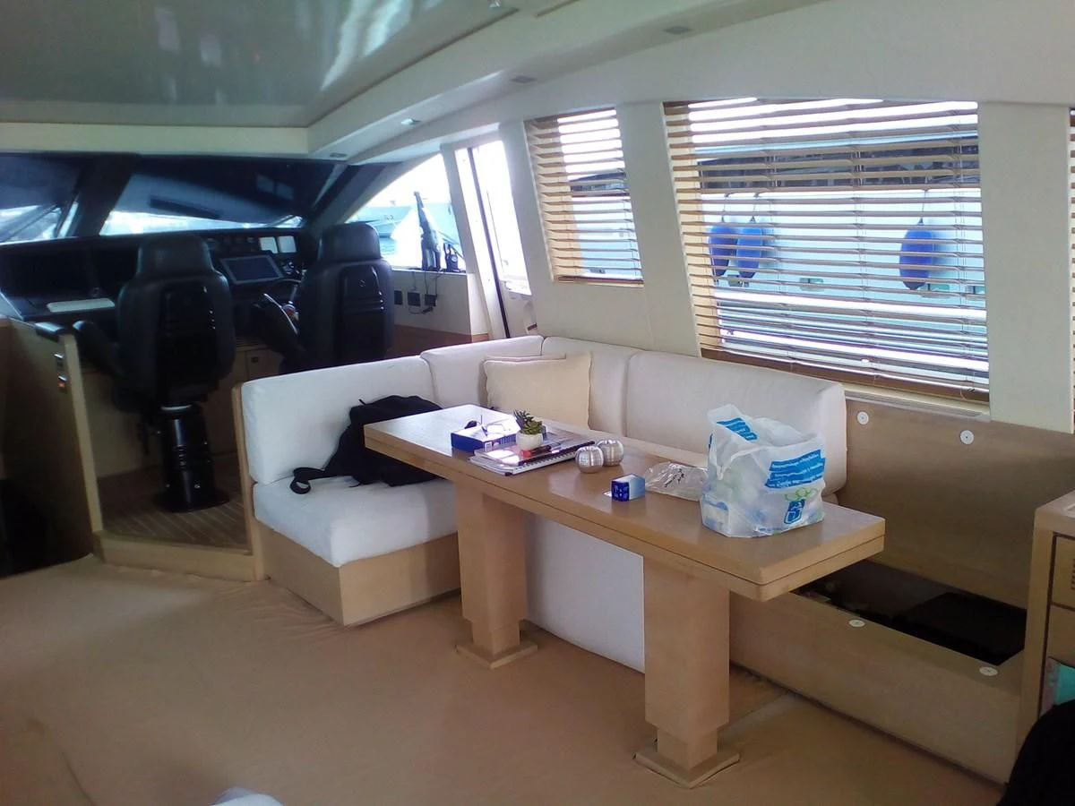 a room with a table and chairs aboard SUN ANEMOS Yacht for Charter