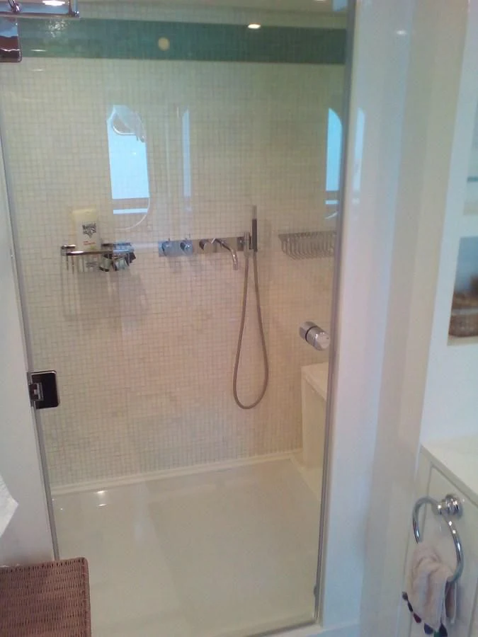 a shower with a glass door aboard SUN ANEMOS Yacht for Charter