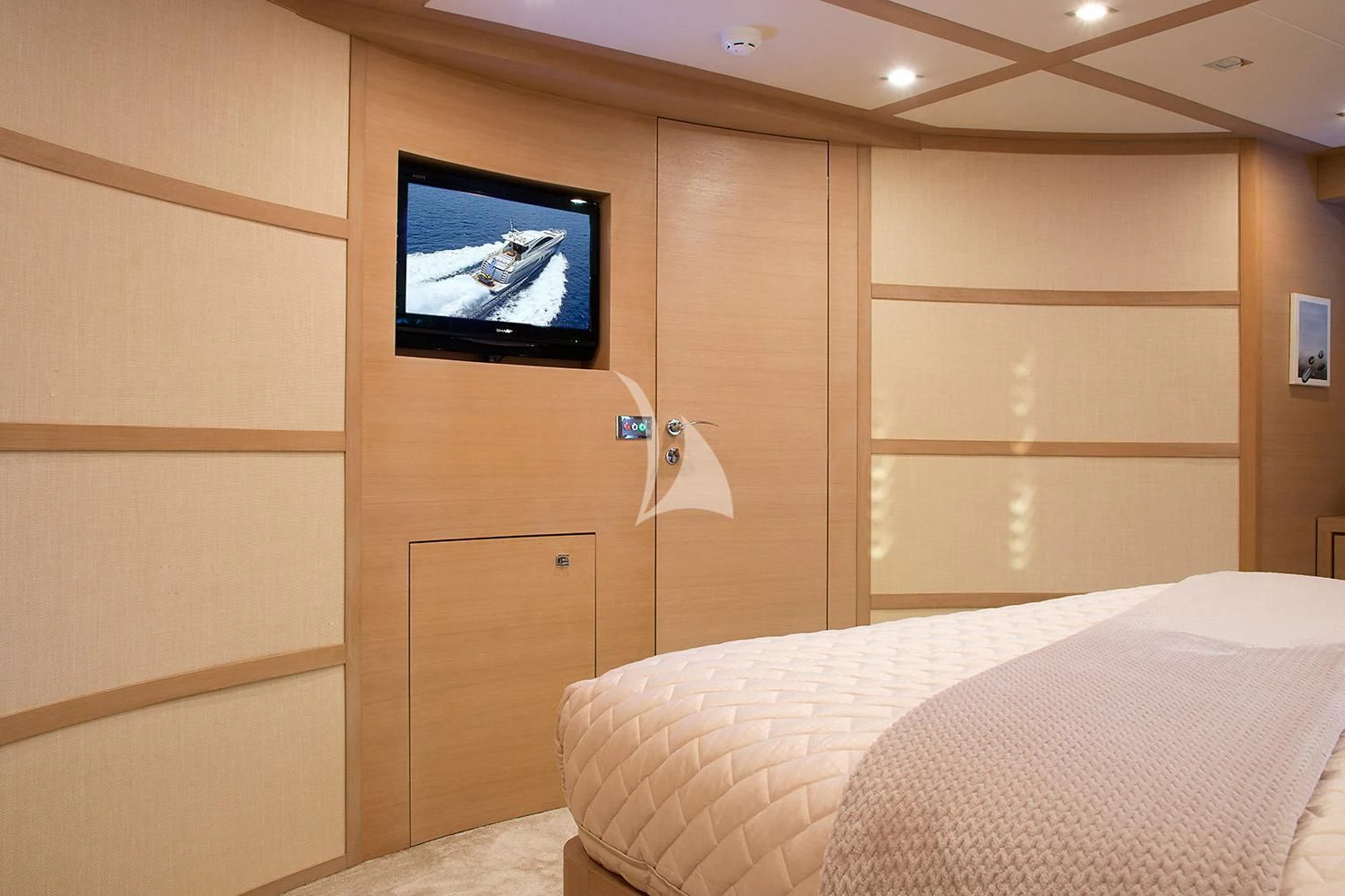 a room with a television and a bed aboard SUN ANEMOS Yacht for Charter