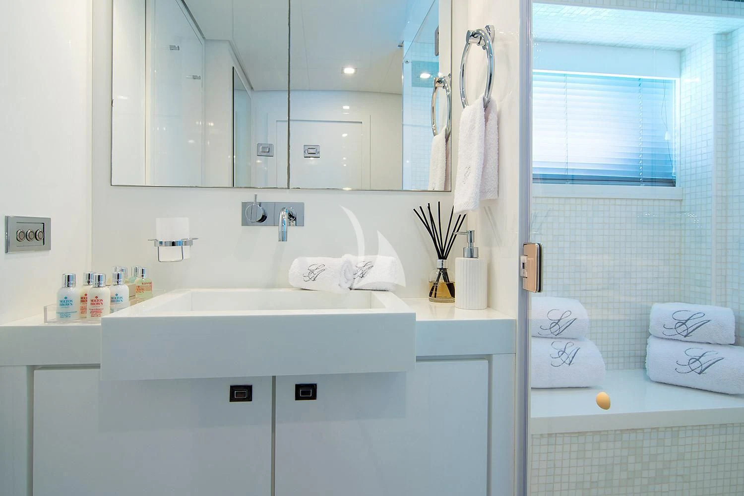 a bathroom with a sink and mirror aboard SUN ANEMOS Yacht for Charter