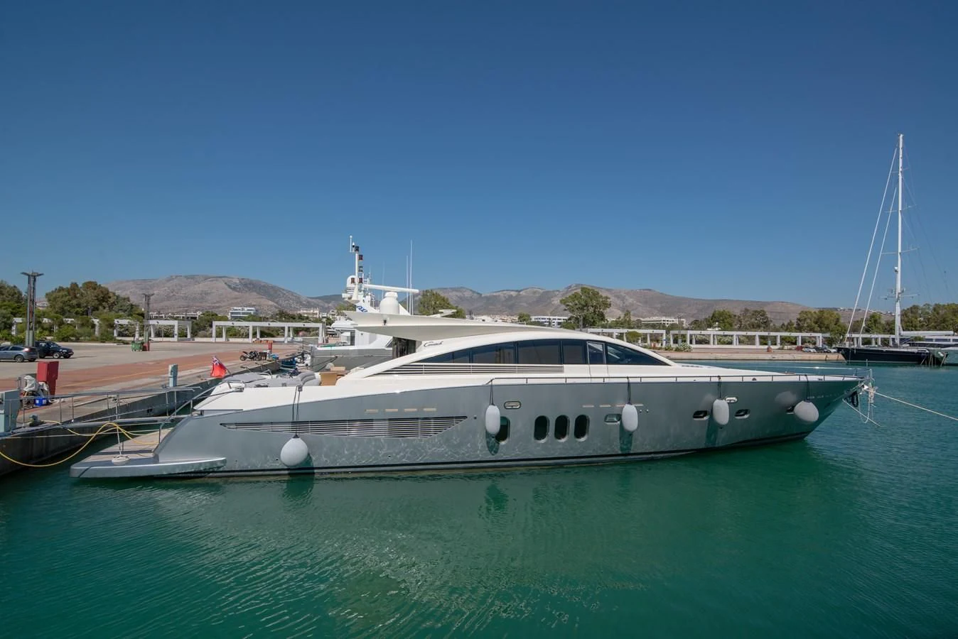 a boat docked at a pier aboard SUN ANEMOS Yacht for Charter