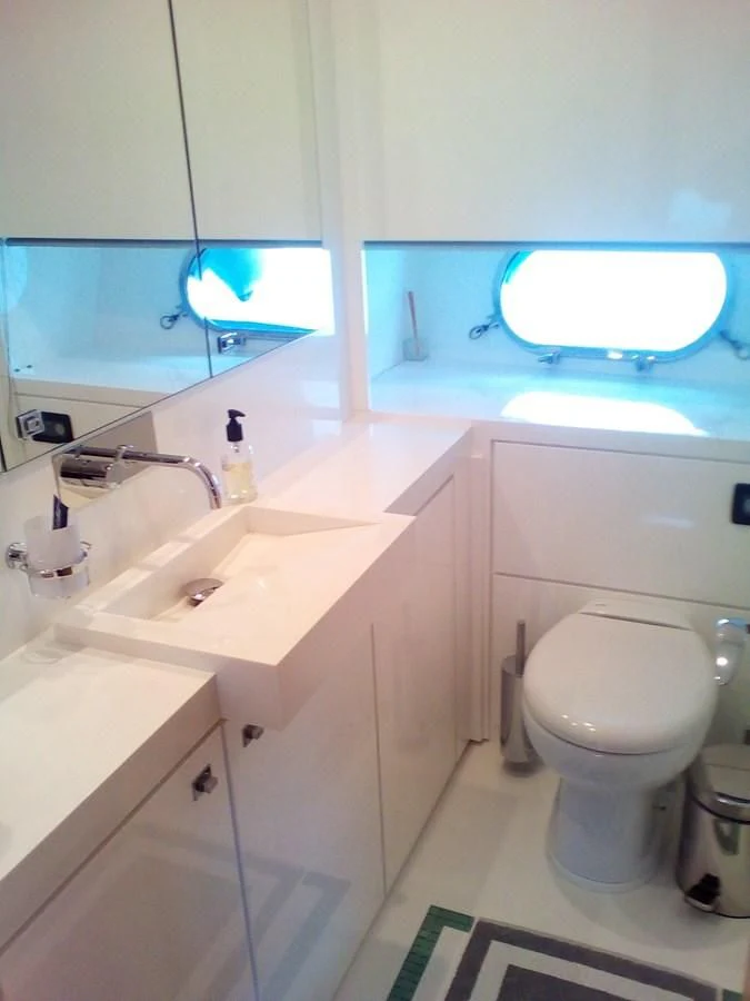 a bathroom with a toilet and a sink aboard SUN ANEMOS Yacht for Charter