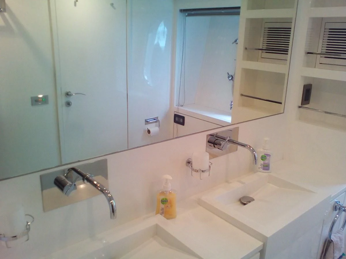 a bathroom with a sink and a mirror aboard SUN ANEMOS Yacht for Charter