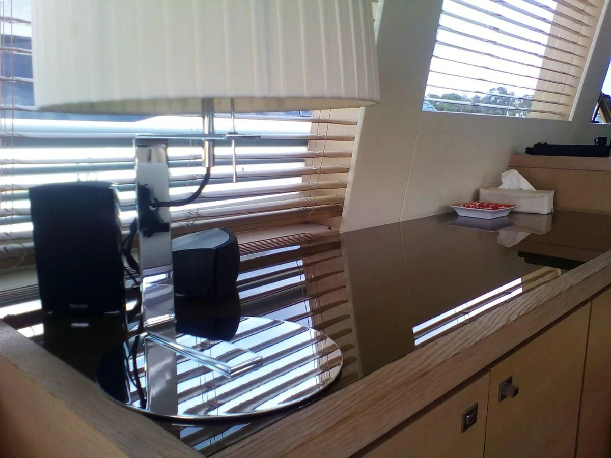 a desk with a computer and a chair aboard SUN ANEMOS Yacht for Charter