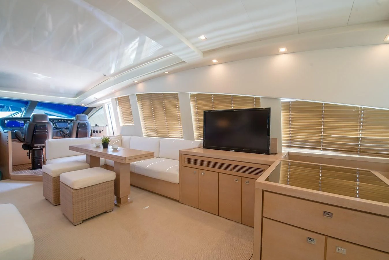 a room with a tv and a table aboard SUN ANEMOS Yacht for Charter