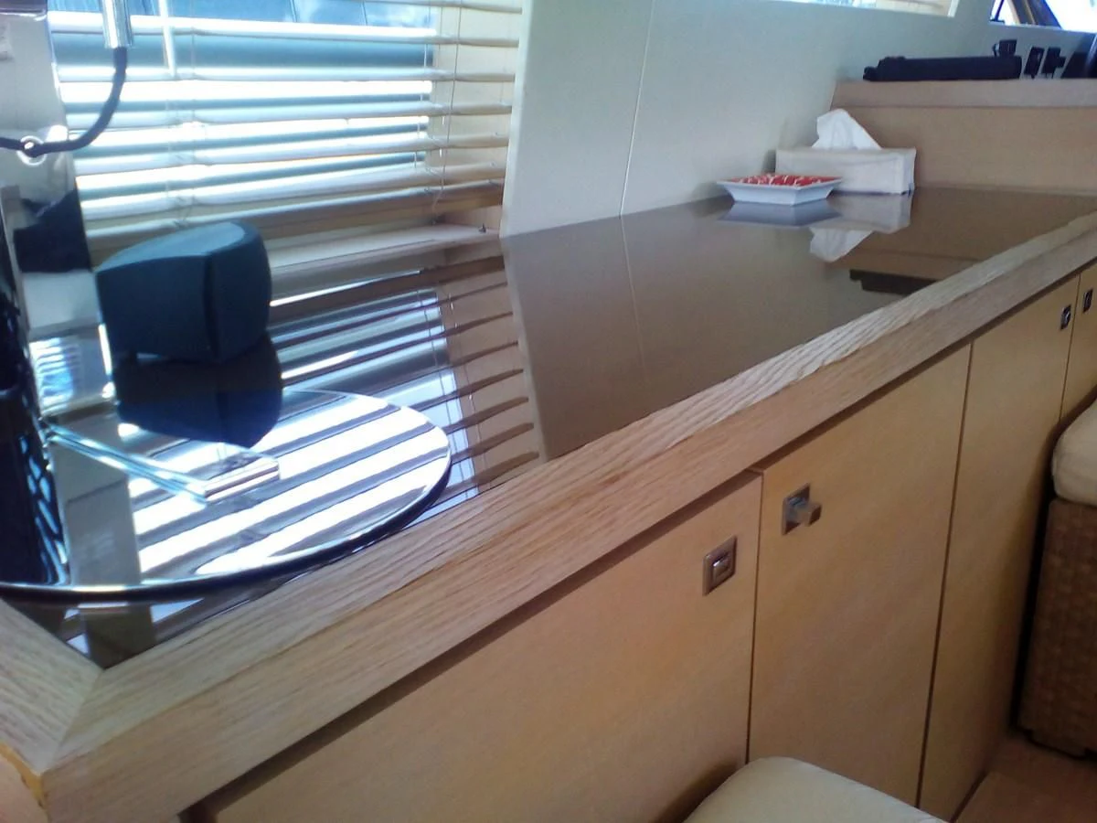 a desk with a computer on it aboard SUN ANEMOS Yacht for Charter