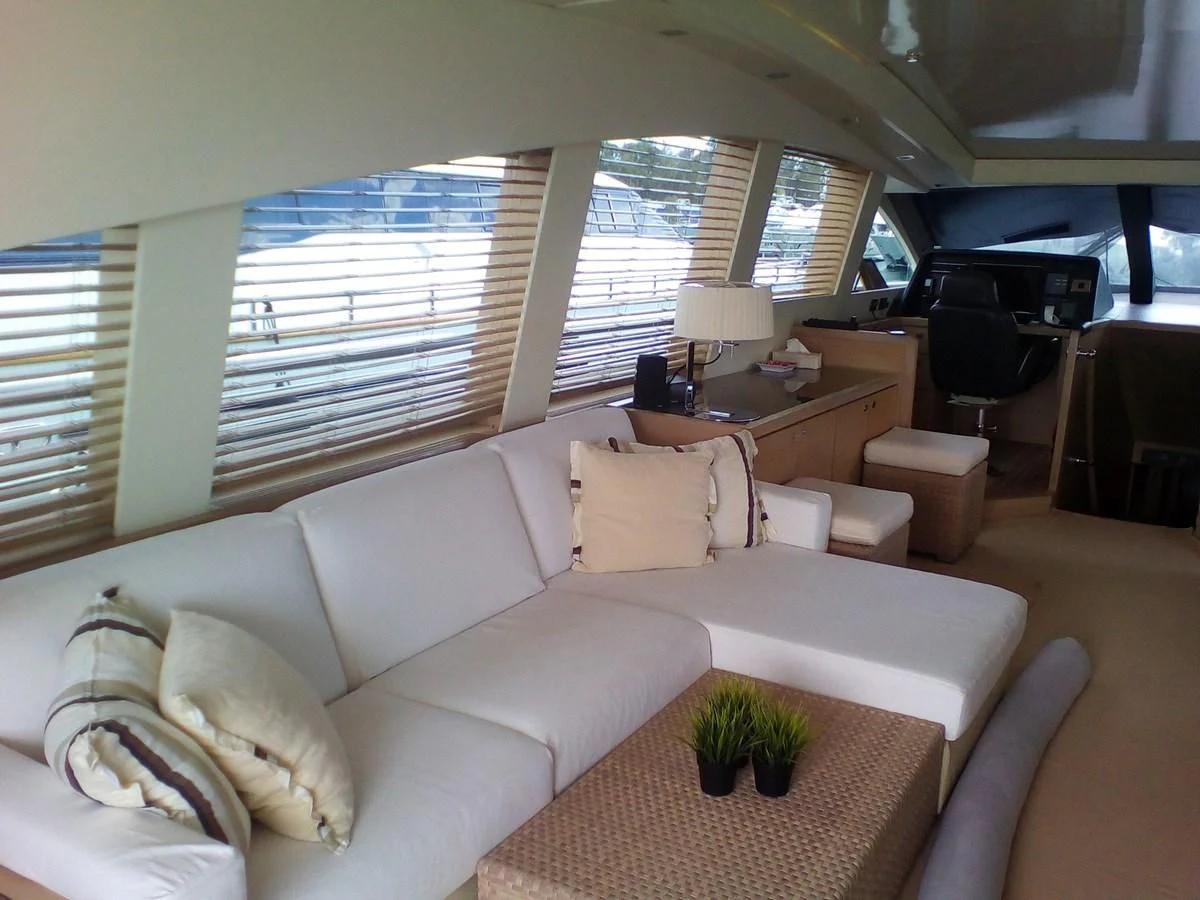 a living room with a couch and a table aboard SUN ANEMOS Yacht for Charter