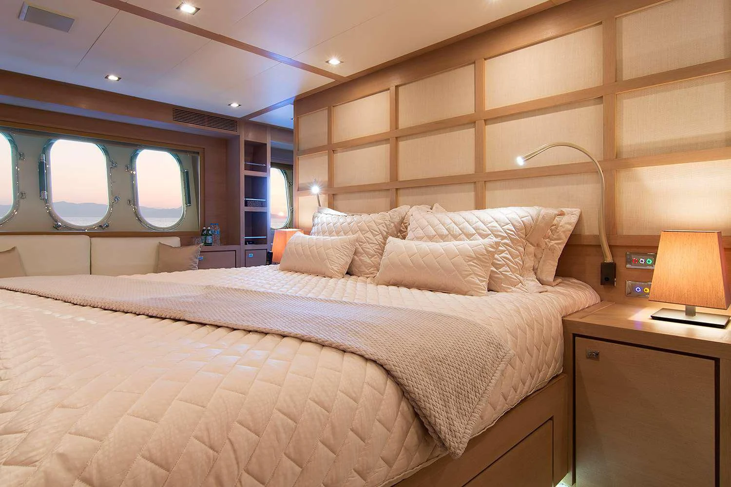 a bed with a large bed aboard SUN ANEMOS Yacht for Charter