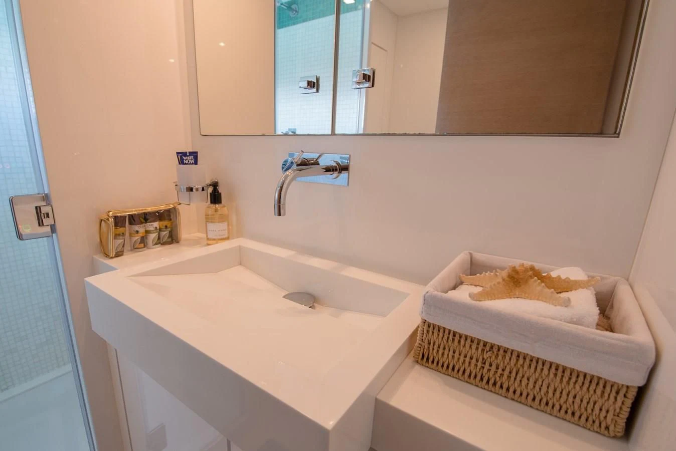 a bathroom with a sink and a mirror aboard SUN ANEMOS Yacht for Charter