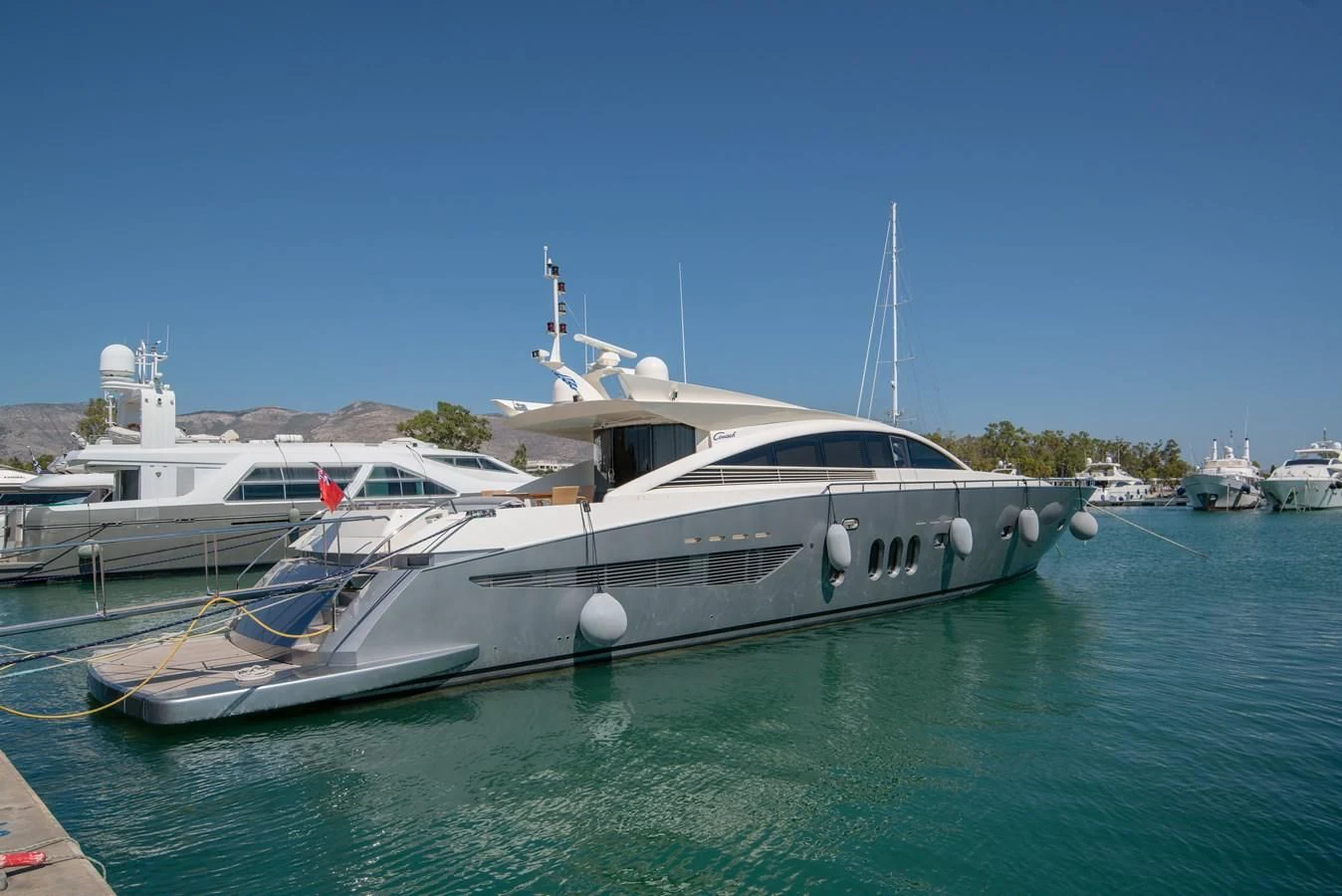 a boat docked at a pier aboard SUN ANEMOS Yacht for Charter