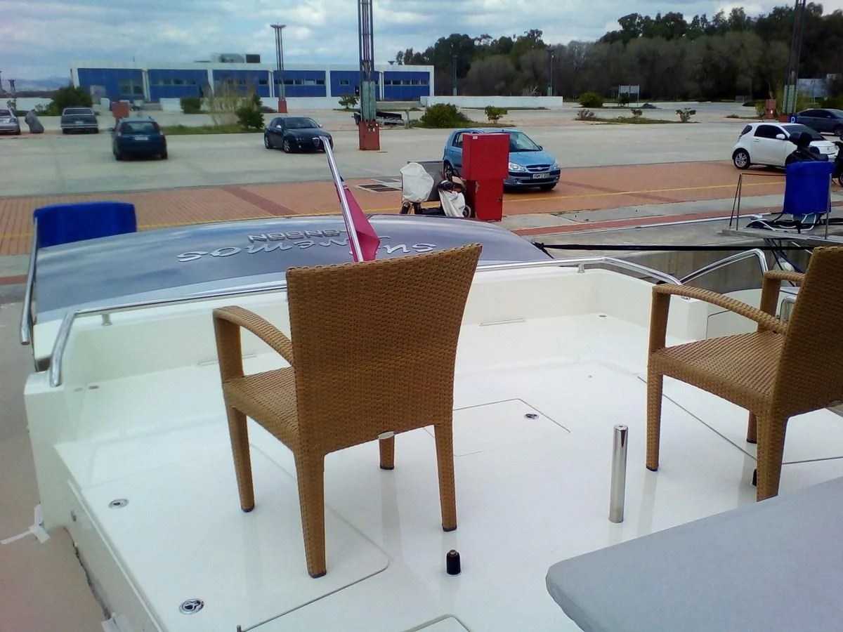 a table with chairs on it aboard SUN ANEMOS Yacht for Charter