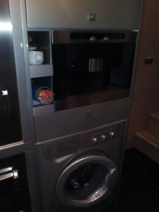 a washing machine with a towel from the door aboard SUN ANEMOS Yacht for Charter