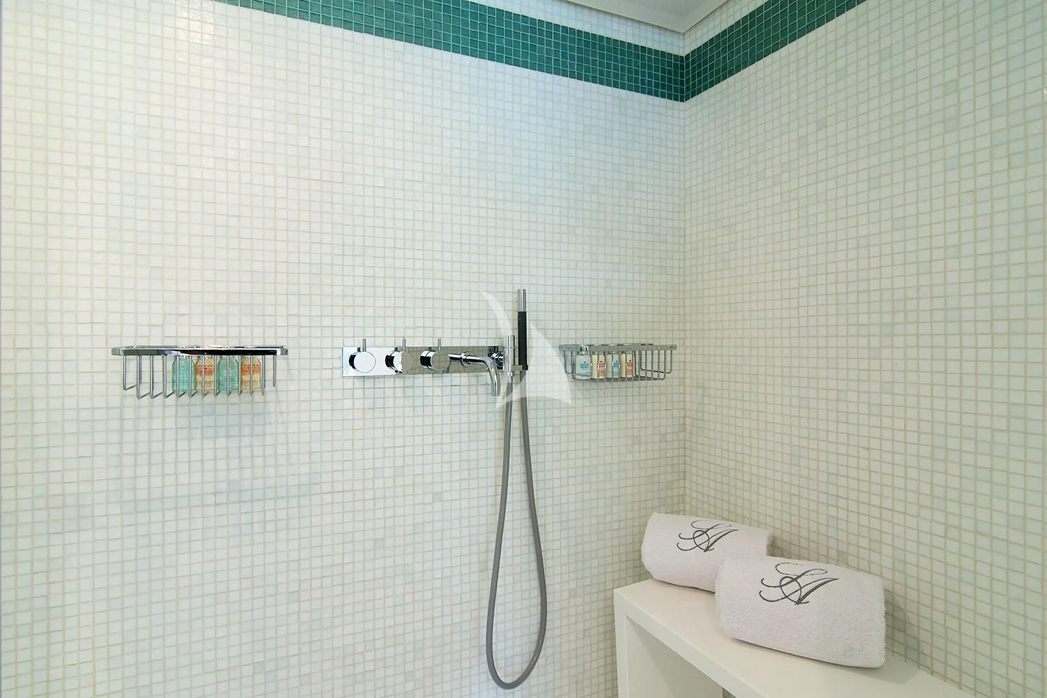 a shower with a toilet paper holder aboard SUN ANEMOS Yacht for Charter