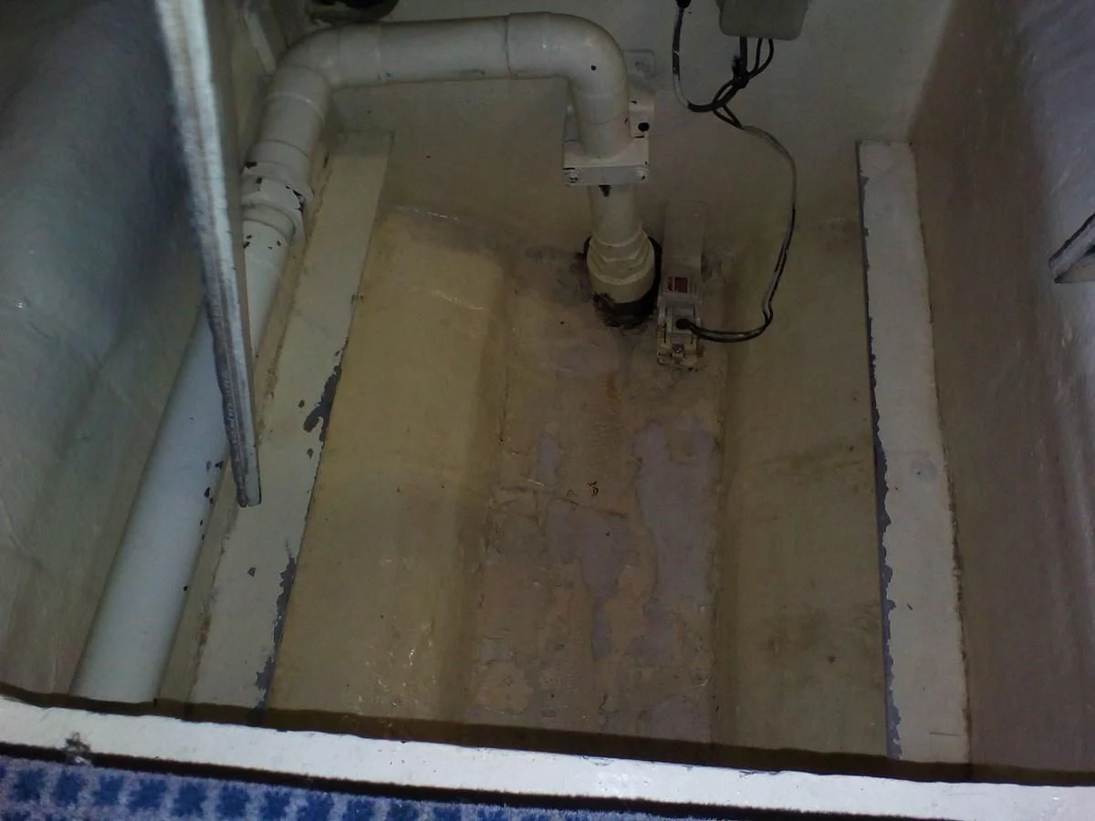 a dirty bathroom with a sink aboard SUN ANEMOS Yacht for Charter