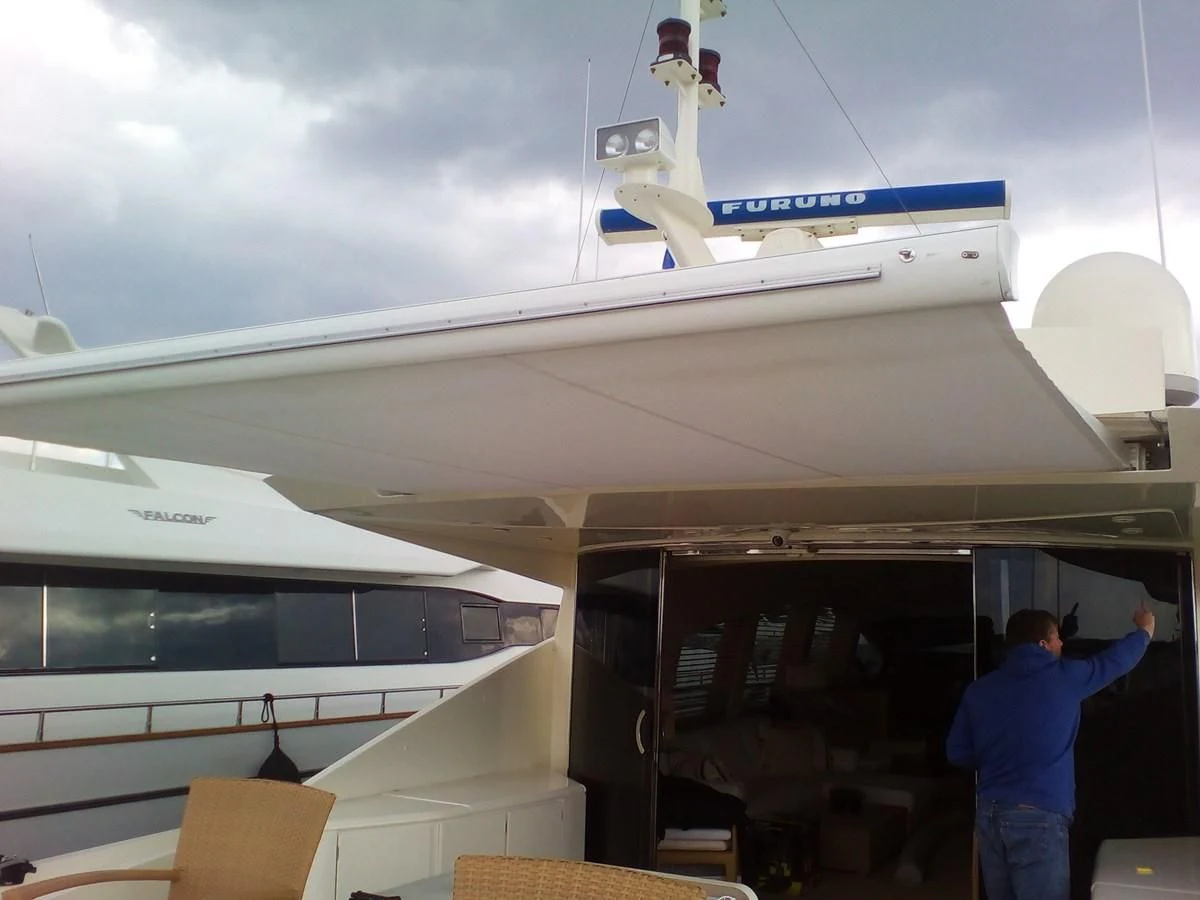 a person standing next to a plane aboard SUN ANEMOS Yacht for Charter