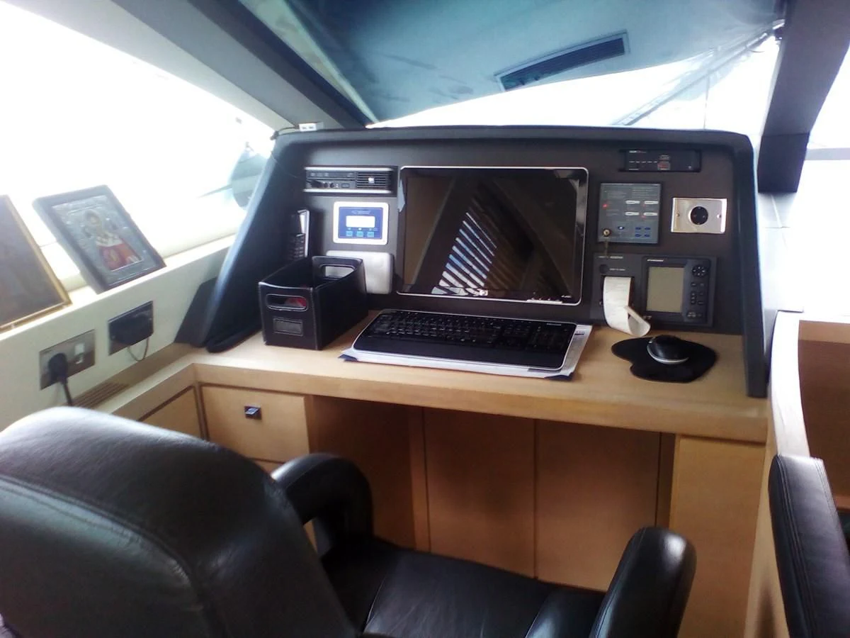 a computer on a desk aboard SUN ANEMOS Yacht for Charter
