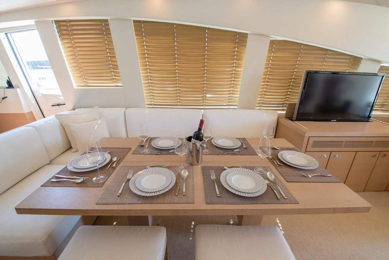 a table with plates and chairs aboard SUN ANEMOS Yacht for Charter