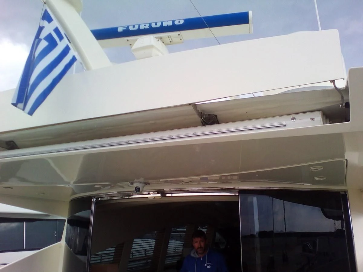 a man standing in front of a plane aboard SUN ANEMOS Yacht for Charter