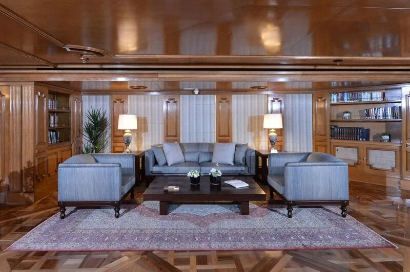a living room with a large mirror aboard LADY SARYA Yacht for Sale