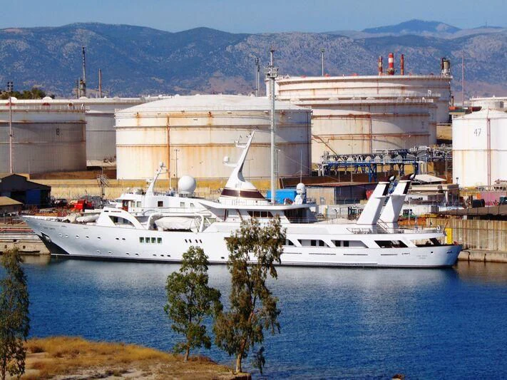 a large white boat in a harbor aboard LADY SARYA Yacht for Sale