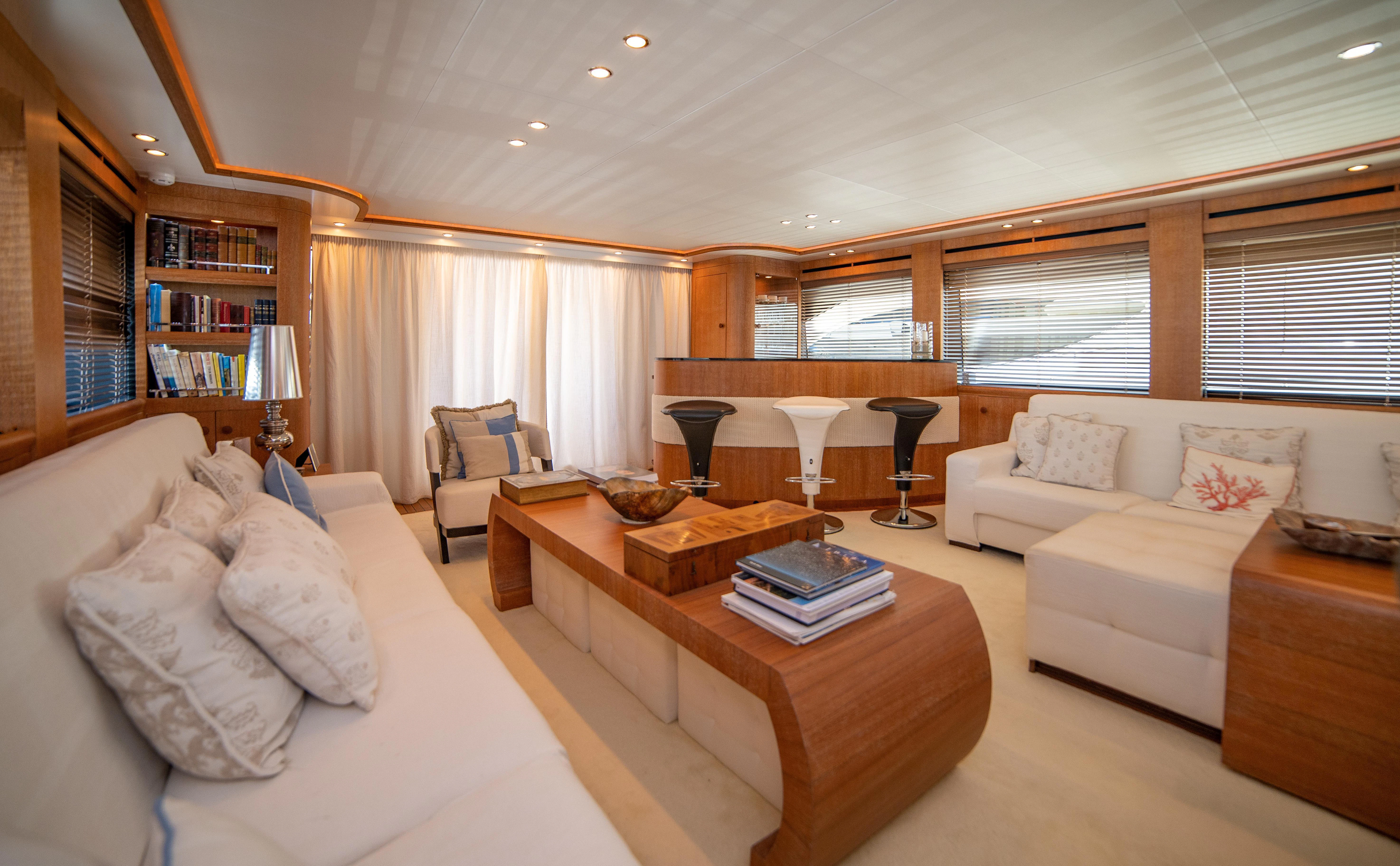 a living room with a couch and a coffee table aboard LADY SARYA Yacht for Sale