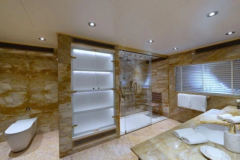 a bathroom with a glass shower aboard LADY SARYA Yacht for Sale