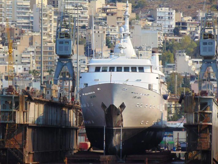 a large white ship in a city aboard LADY SARYA Yacht for Sale