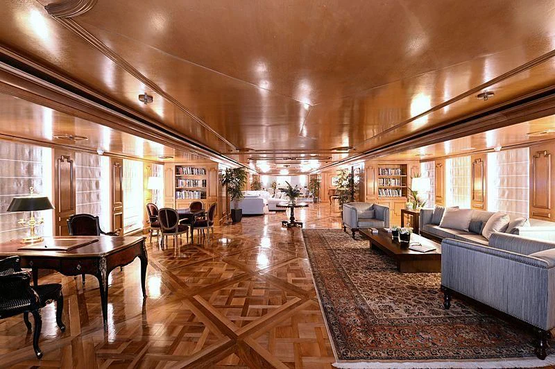 a large living room with a large wood floor aboard LADY SARYA Yacht for Sale