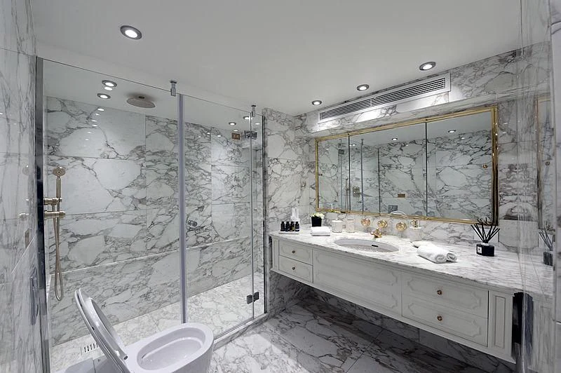 a bathroom with a large mirror aboard LADY SARYA Yacht for Sale