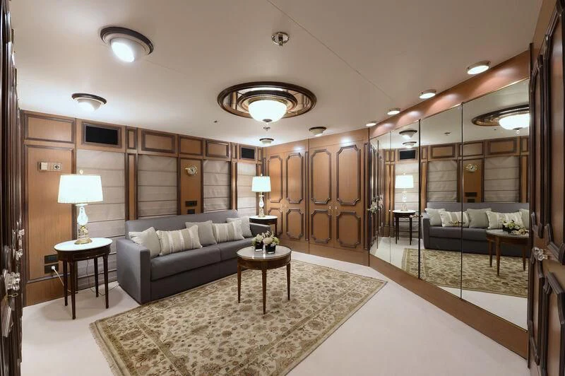 a living room with a large mirror aboard LADY SARYA Yacht for Sale
