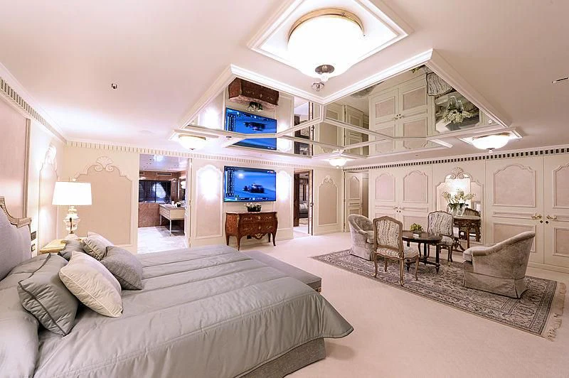a large bedroom with a bed and a tv aboard LADY SARYA Yacht for Sale