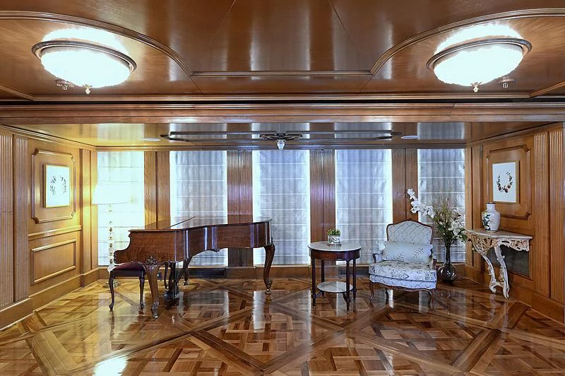 a room with a table chairs and a window aboard LADY SARYA Yacht for Sale