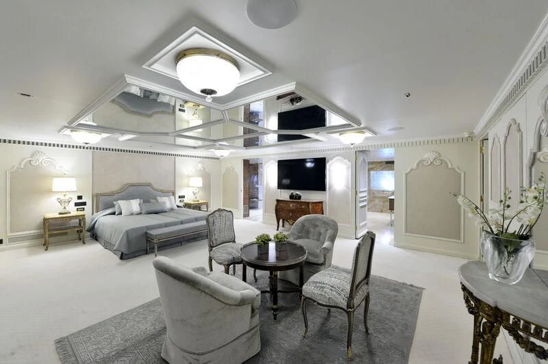 a living room with a couch and a table aboard LADY SARYA Yacht for Sale