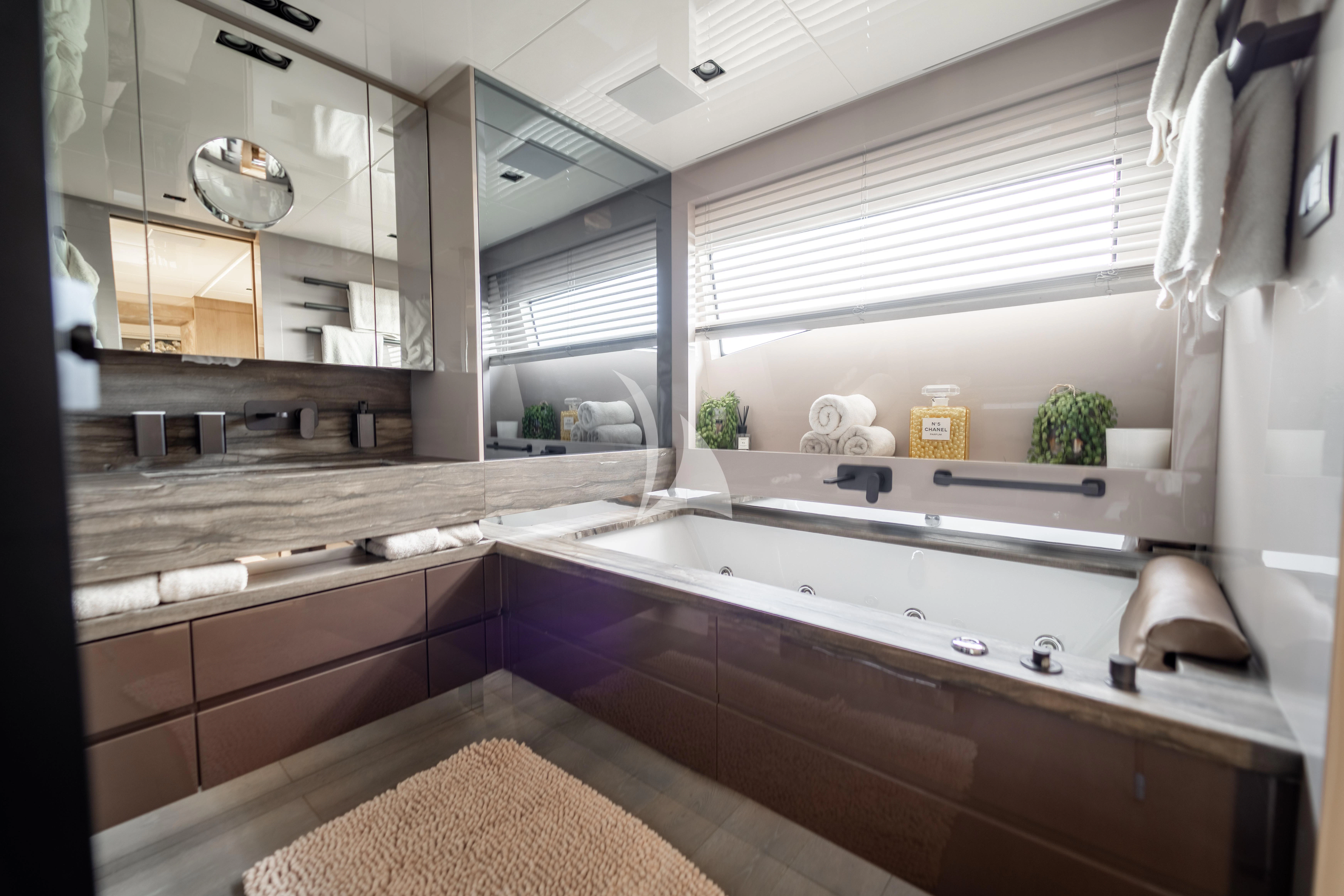 a bathroom with a large mirror aboard THE PALM Yacht for Sale