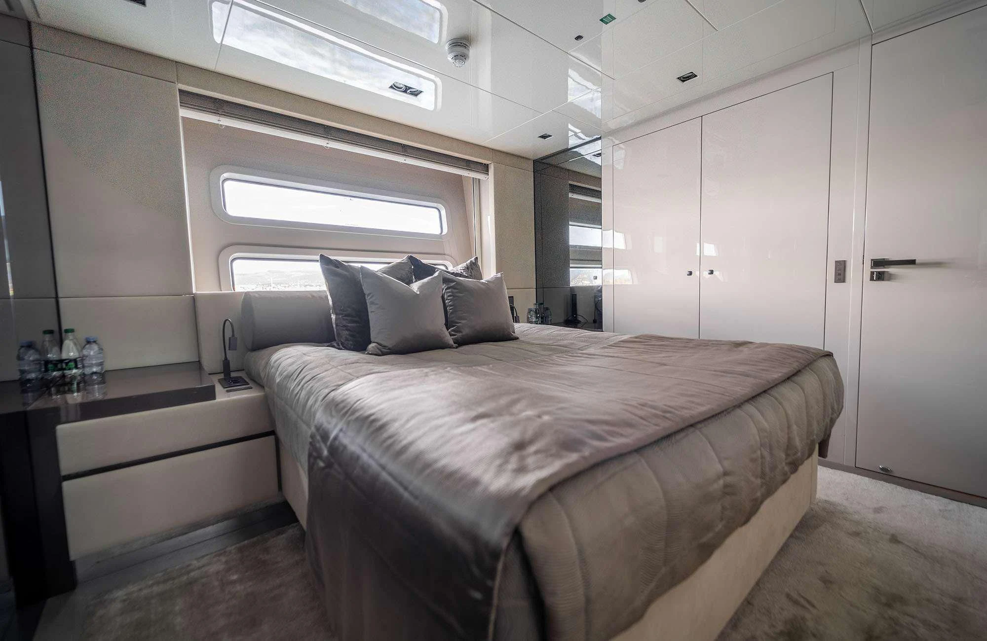 a bed in a room aboard THE PALM Yacht for Sale