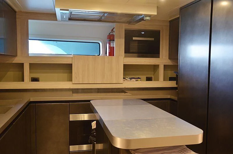 a room with a table and a window aboard THE PALM Yacht for Sale