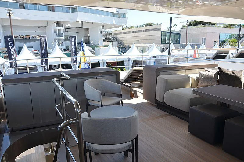 a room with a couch and a table and chairs aboard THE PALM Yacht for Sale