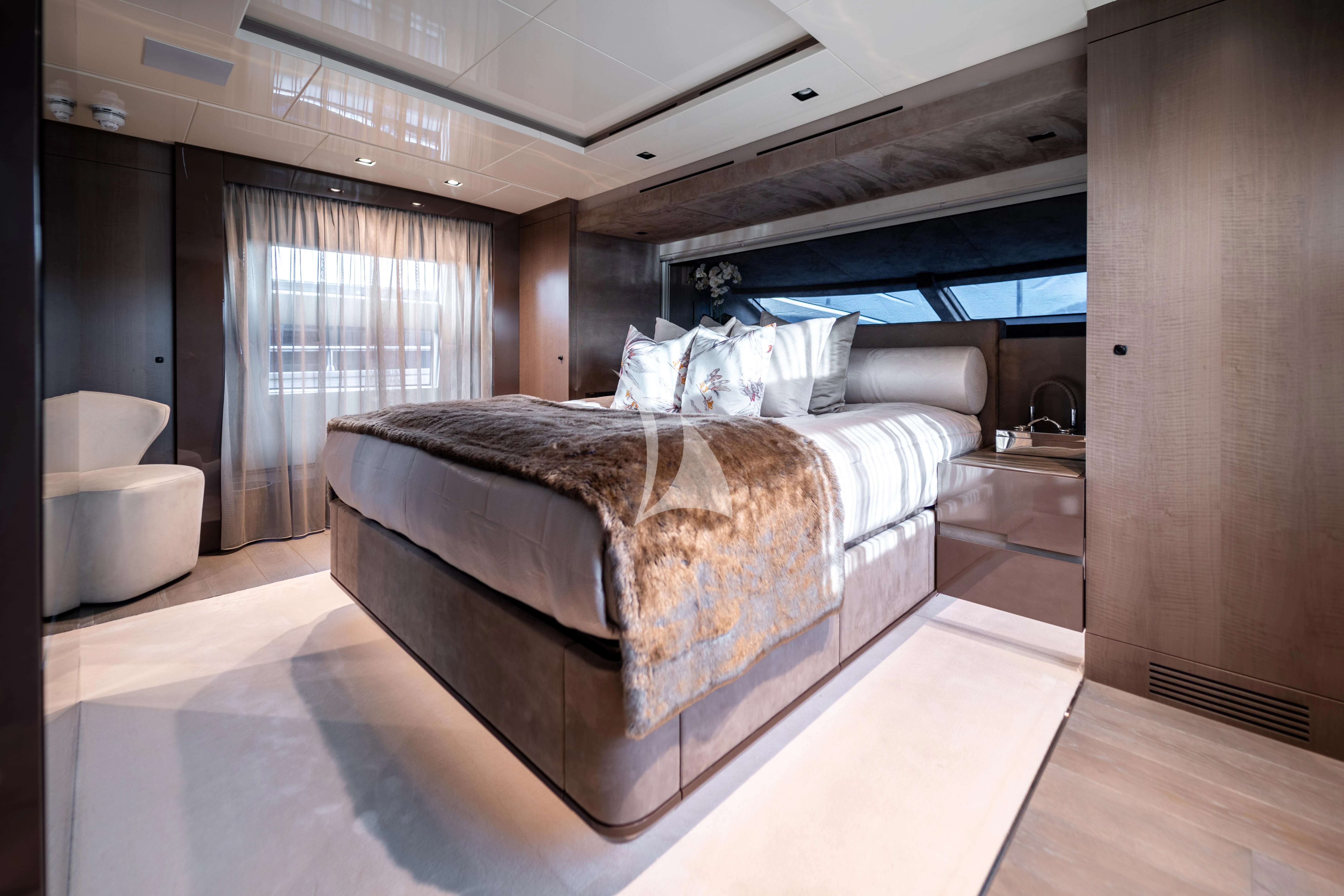 a bedroom with a bed aboard THE PALM Yacht for Sale