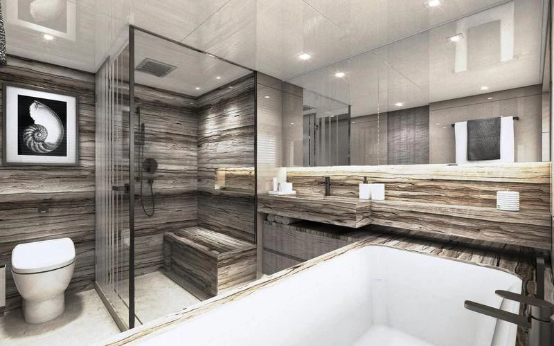 a bathroom with a tub and a toilet aboard THE PALM Yacht for Sale