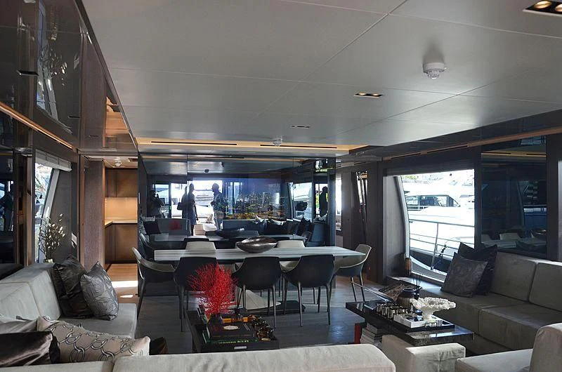 a living room with a large window aboard THE PALM Yacht for Sale