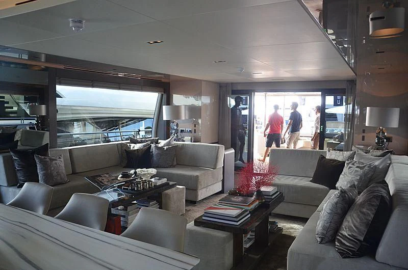 a living room with a large window aboard THE PALM Yacht for Sale