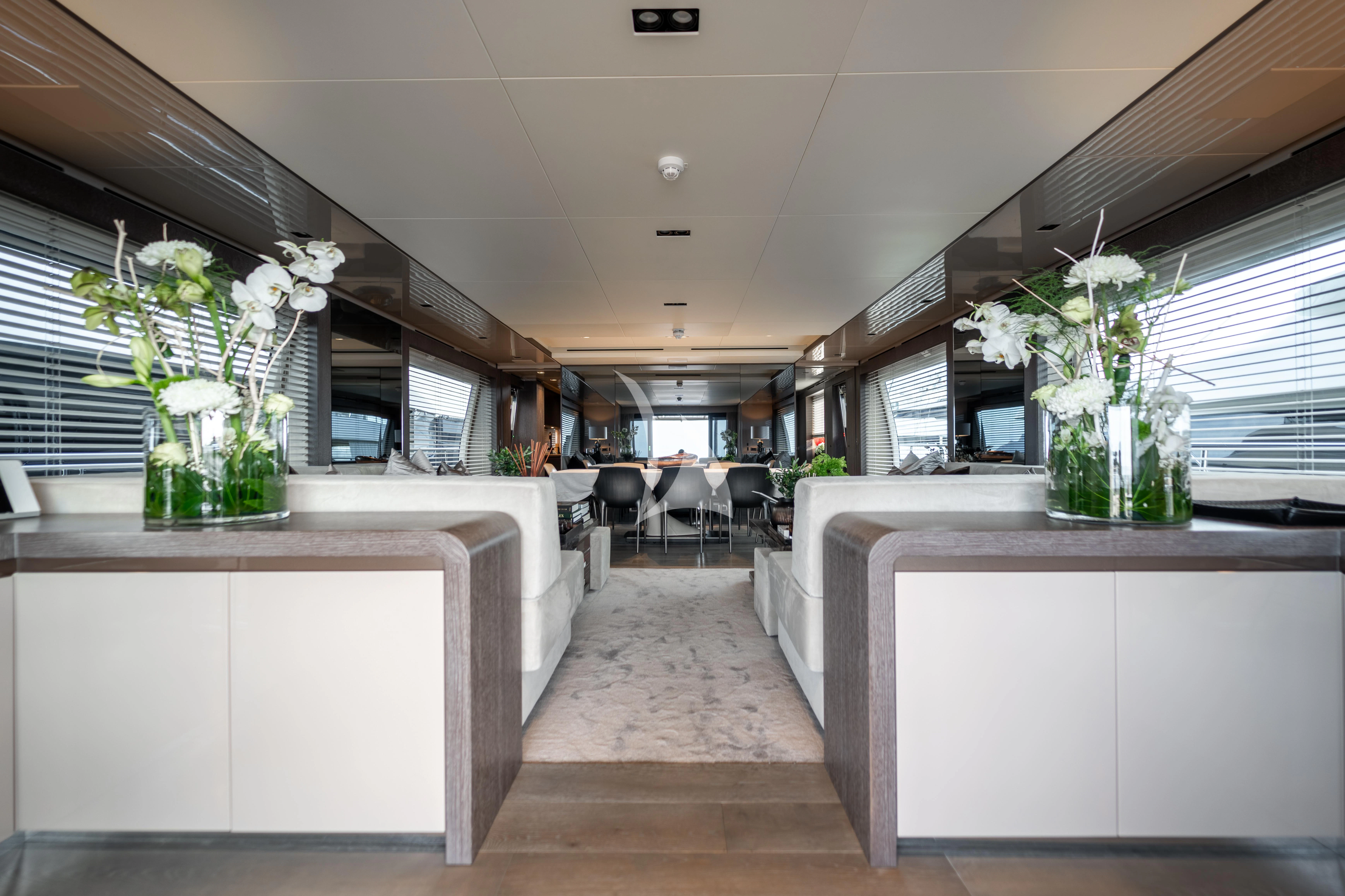 a room with a counter and chairs aboard THE PALM Yacht for Sale