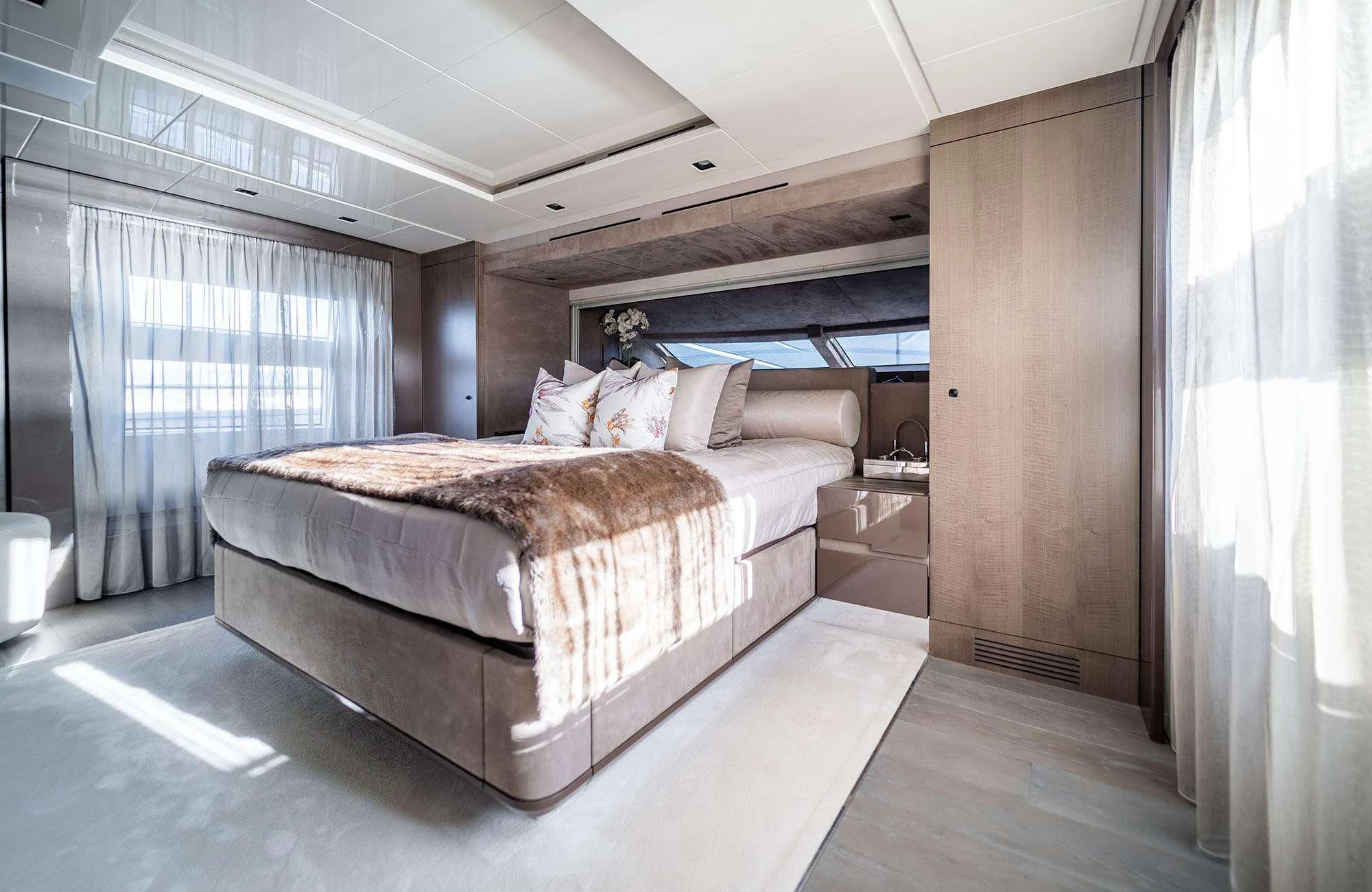 a bedroom with a large bed aboard THE PALM Yacht for Sale