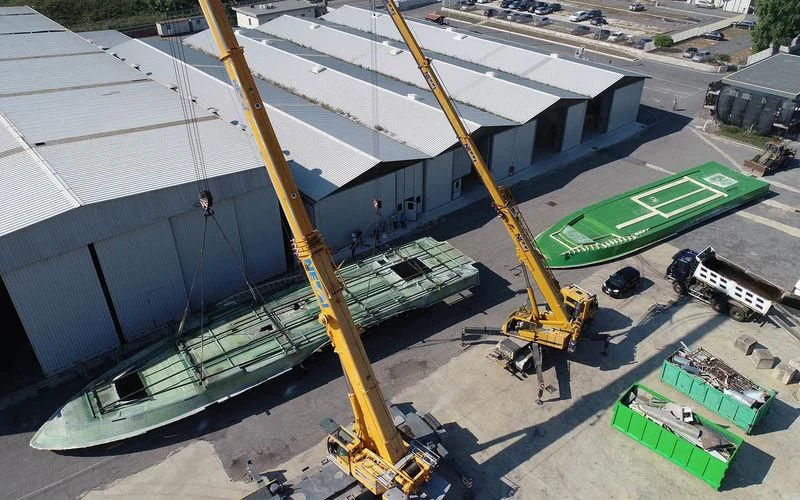 a construction site with several cranes aboard THE PALM Yacht for Sale