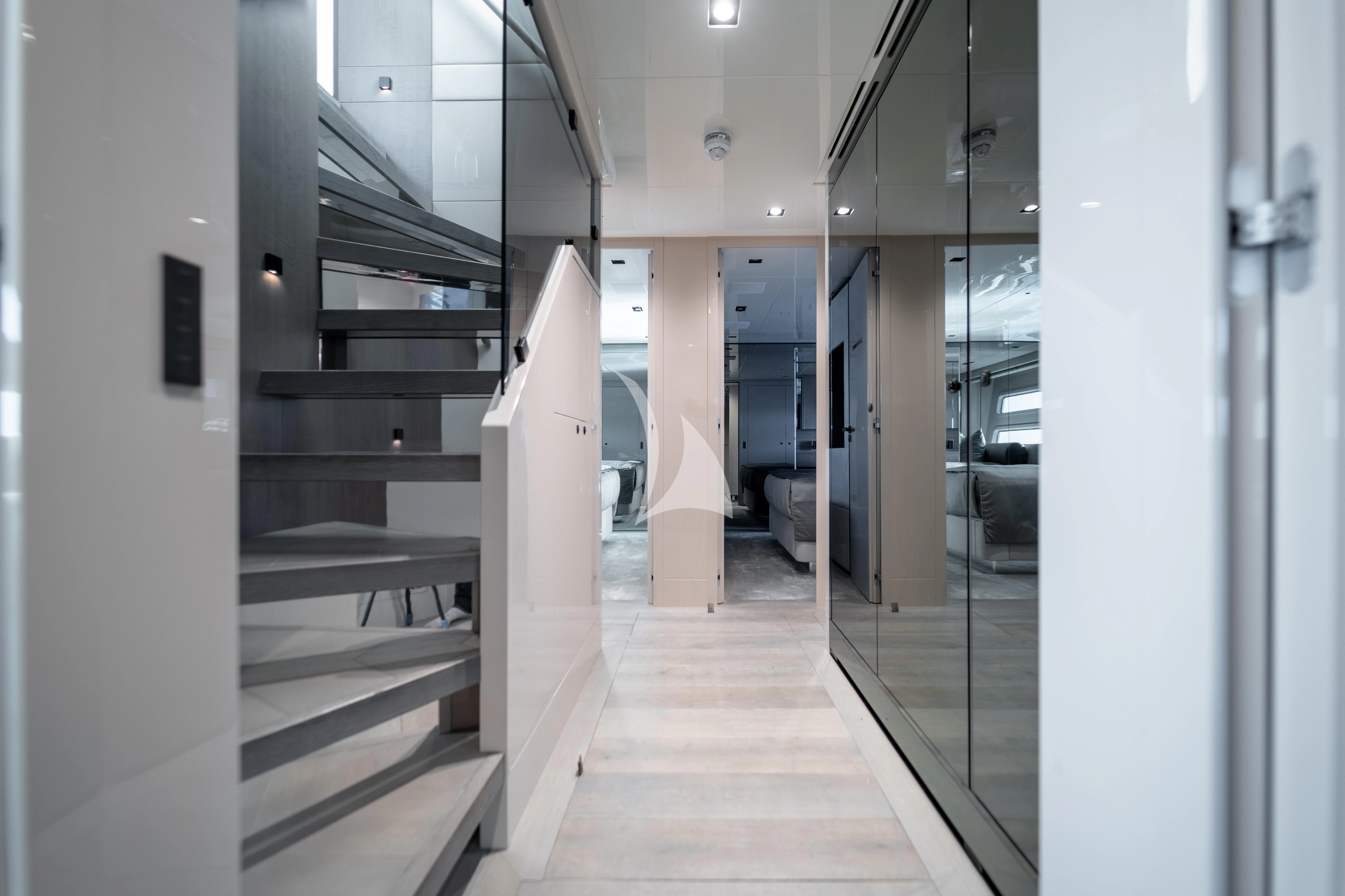 a hallway with white walls aboard THE PALM Yacht for Sale